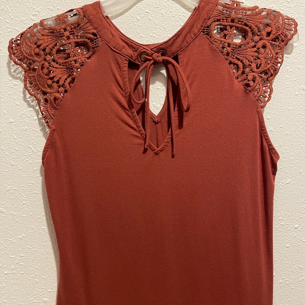 Women’s dress top with lacy sleeves